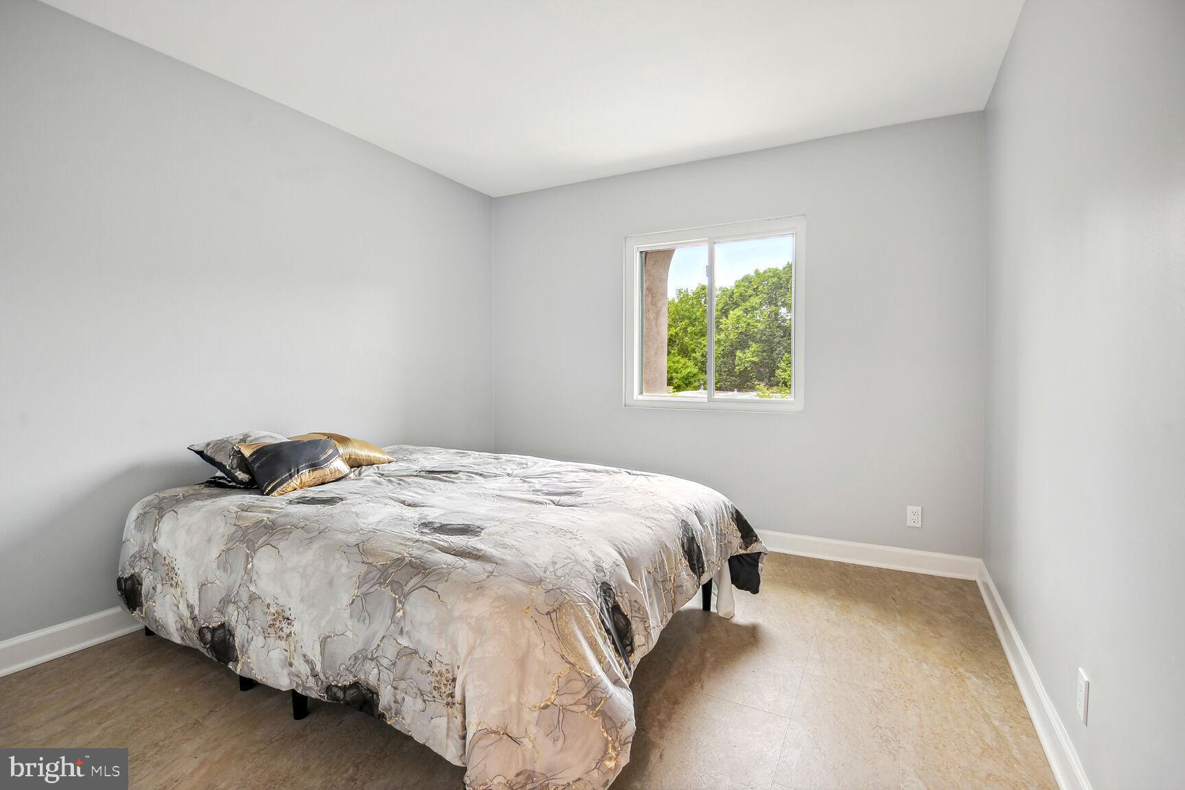 1635 Valencia Way Reston, VA 20190 - Photo 18 of 22 a bedroom with a bed and a window