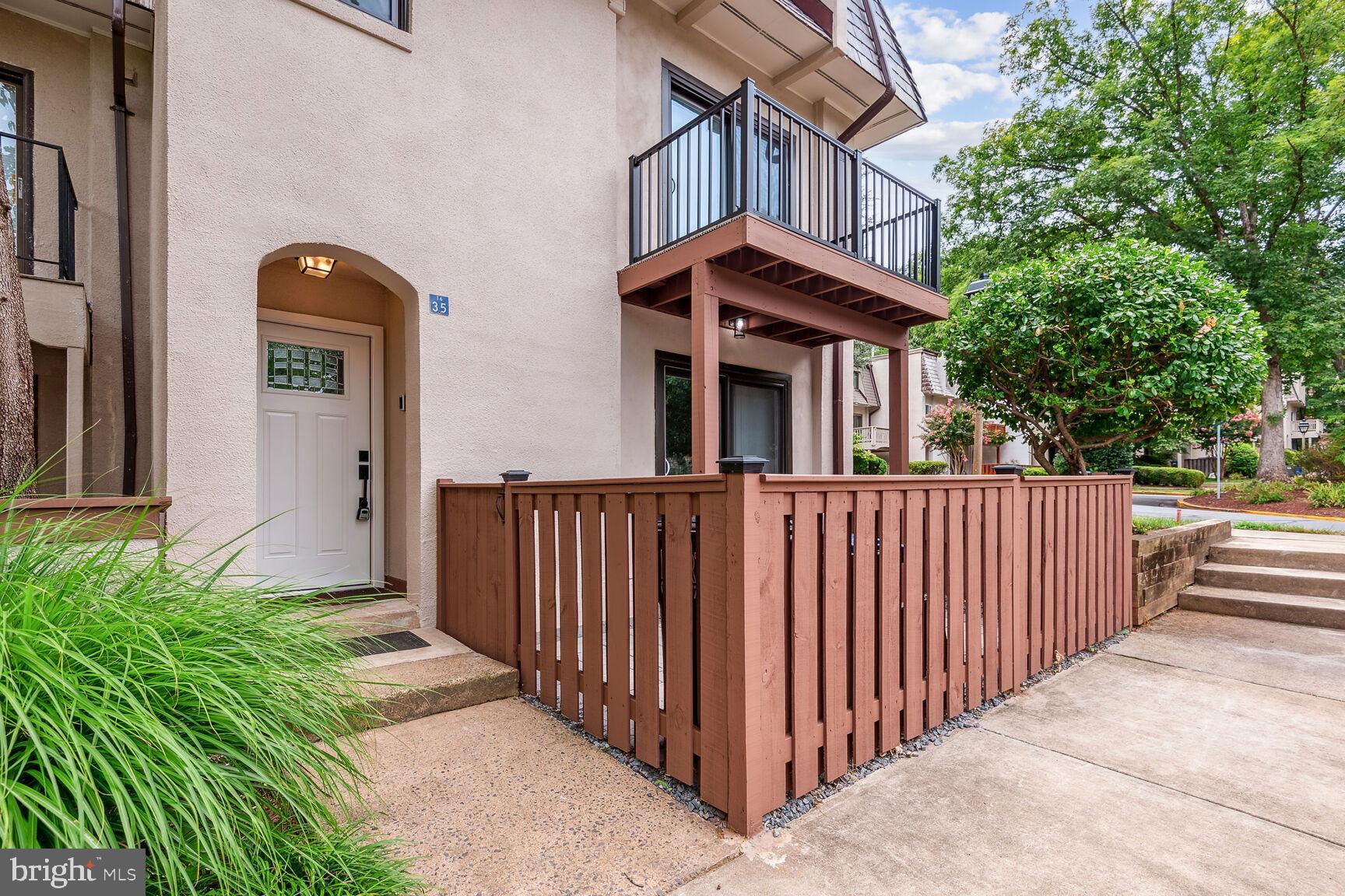 1635 Valencia Way Reston, VA 20190 - Photo 2 of 22 a view of a brick house with large windows