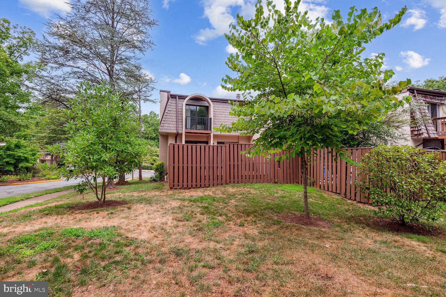 1635 Valencia Way Reston, VA 20190 - Photo 22 of 22 a view of a yard with plants and trees