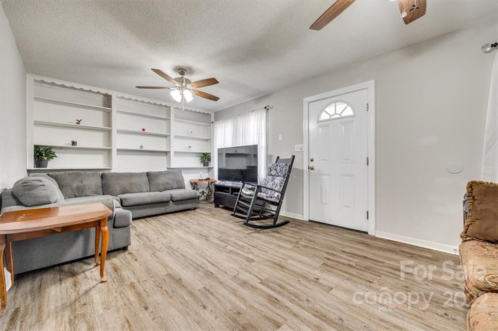 231 Essie Circle Fort Mill, SC 29708 - Photo 5 of 28 a living room with furniture and a wooden floor