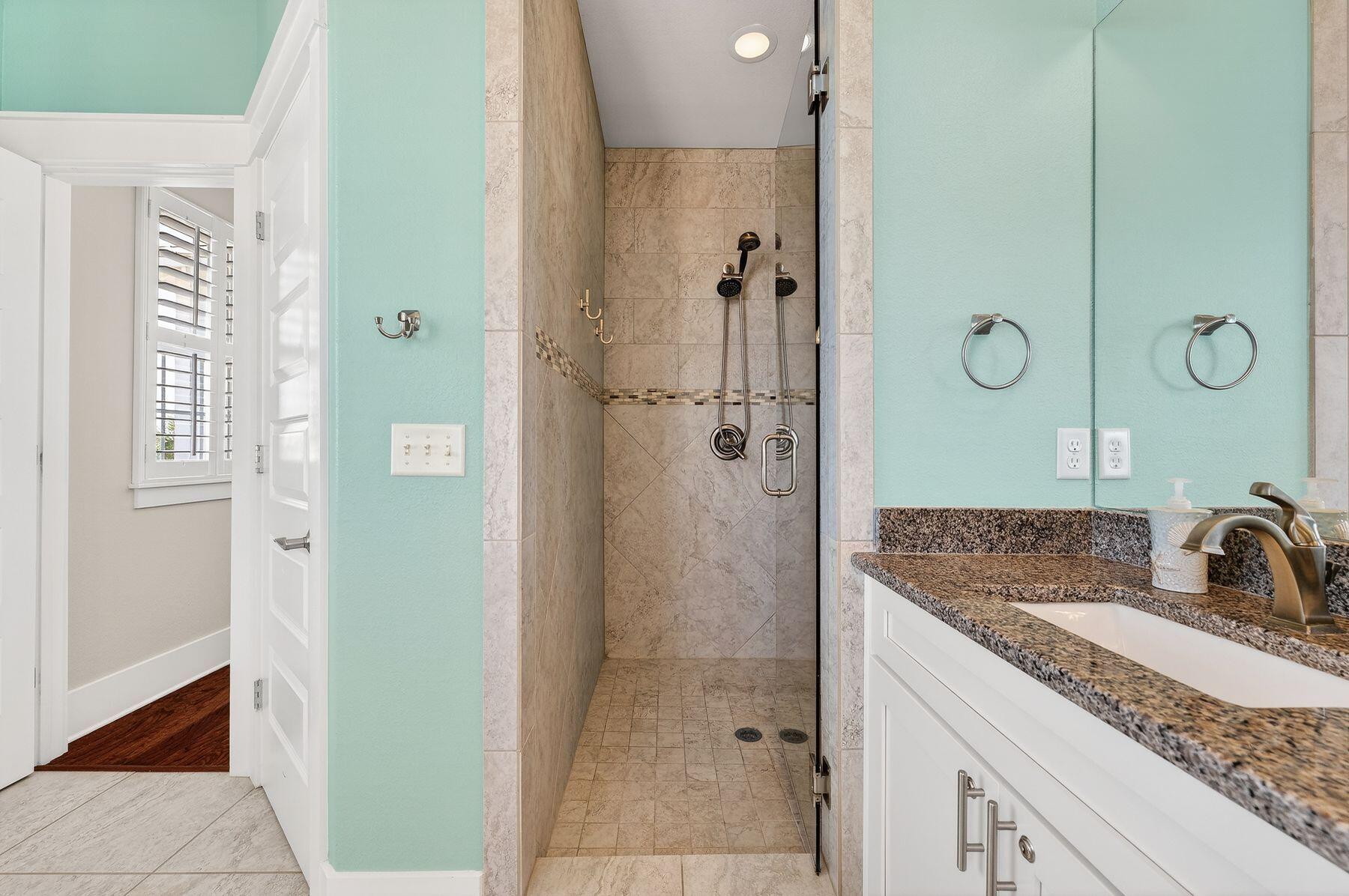 4480 Ocean View Drive Destin, FL 32541 - Photo 21 of 34 a bathroom with a granite countertop sink two mirror and shower