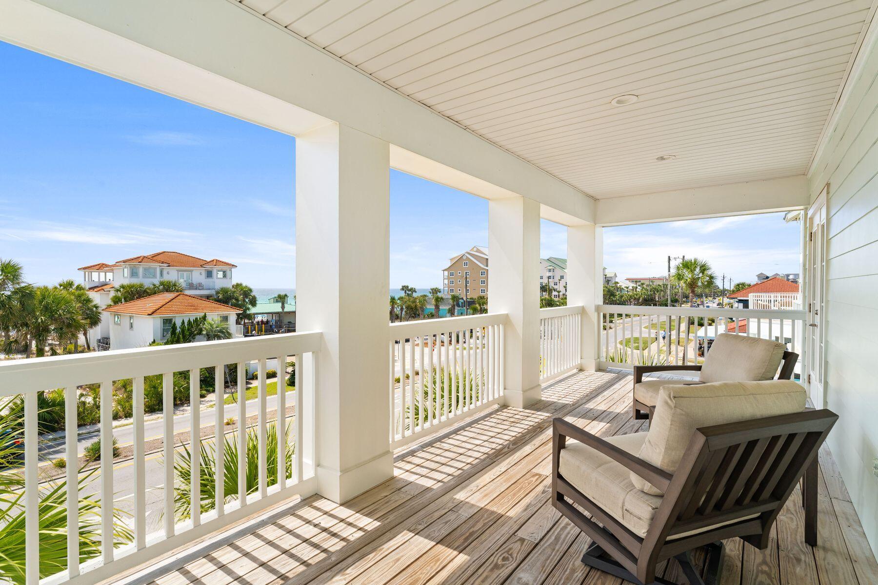 4480 Ocean View Drive Destin, FL 32541 - Photo 24 of 34 a view of a balcony with wooden floor and outdoor seating