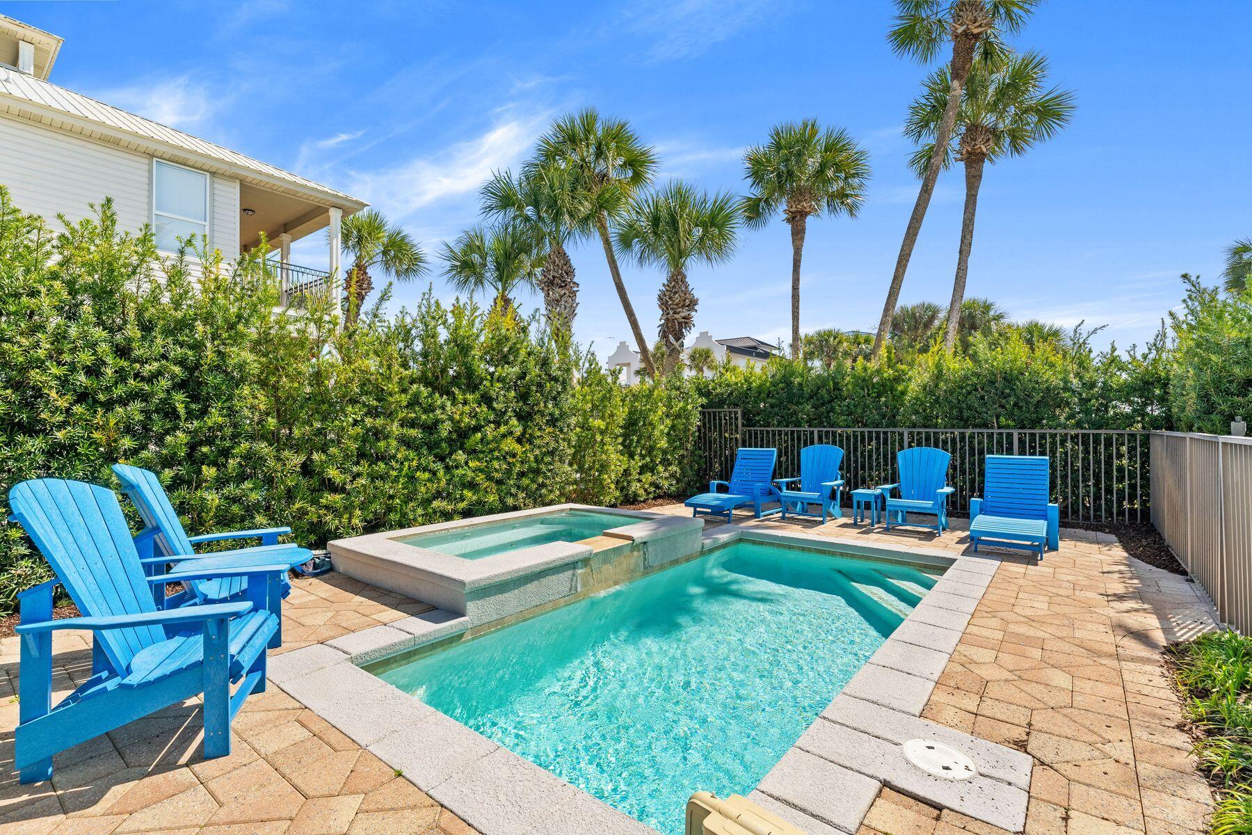 4480 Ocean View Drive Destin, FL 32541 - Photo 28 of 34 a view of a backyard with couches plants and palm trees
