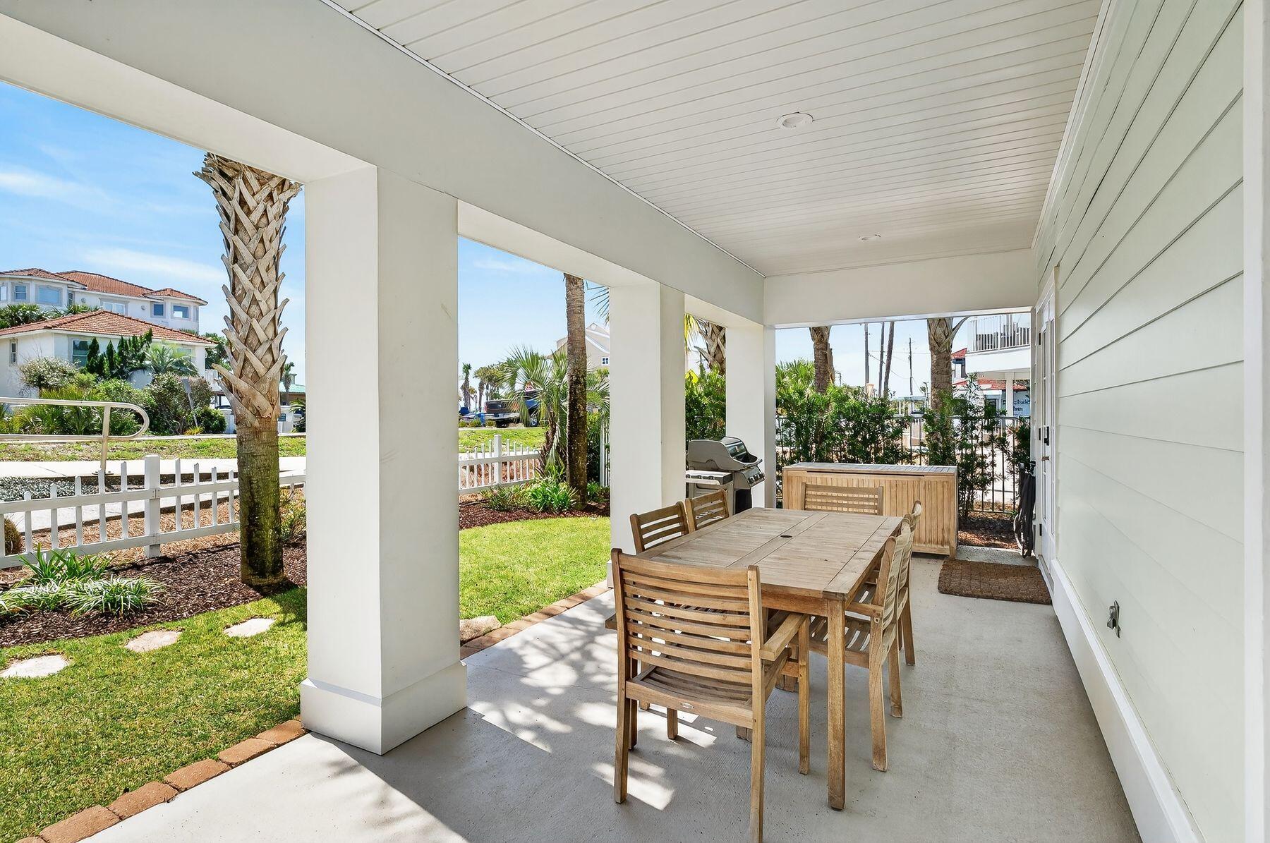 4480 Ocean View Drive Destin, FL 32541 - Photo 31 of 34 a view of an outdoor dining space with a table and chairs