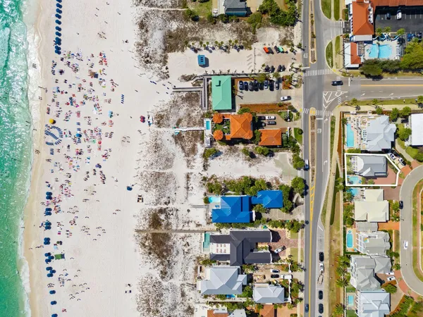 an aerial view of residential houses with outdoor space