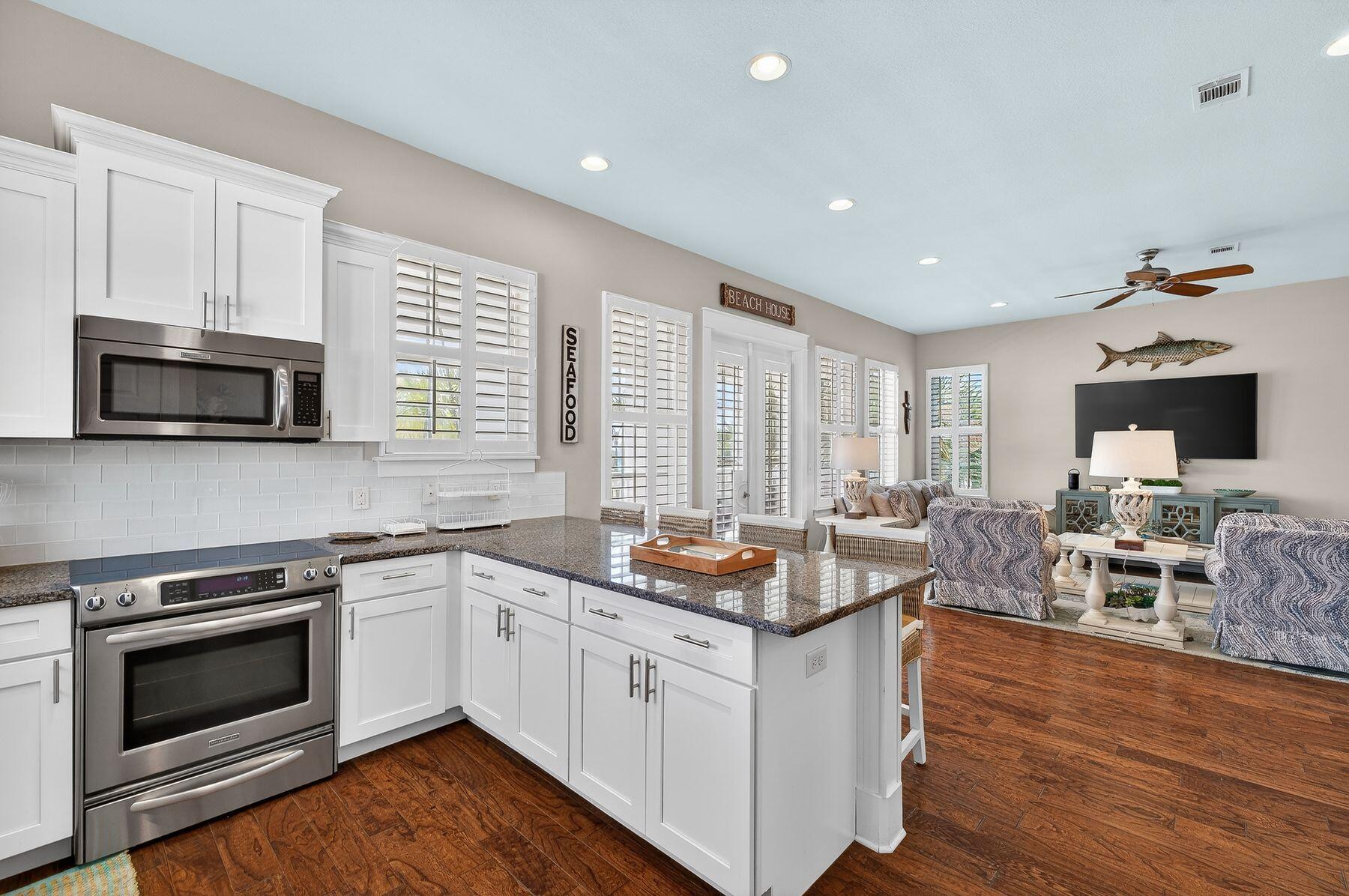 4480 Ocean View Drive Destin, FL 32541 - Photo 7 of 34 a open kitchen with sink stove and microwave