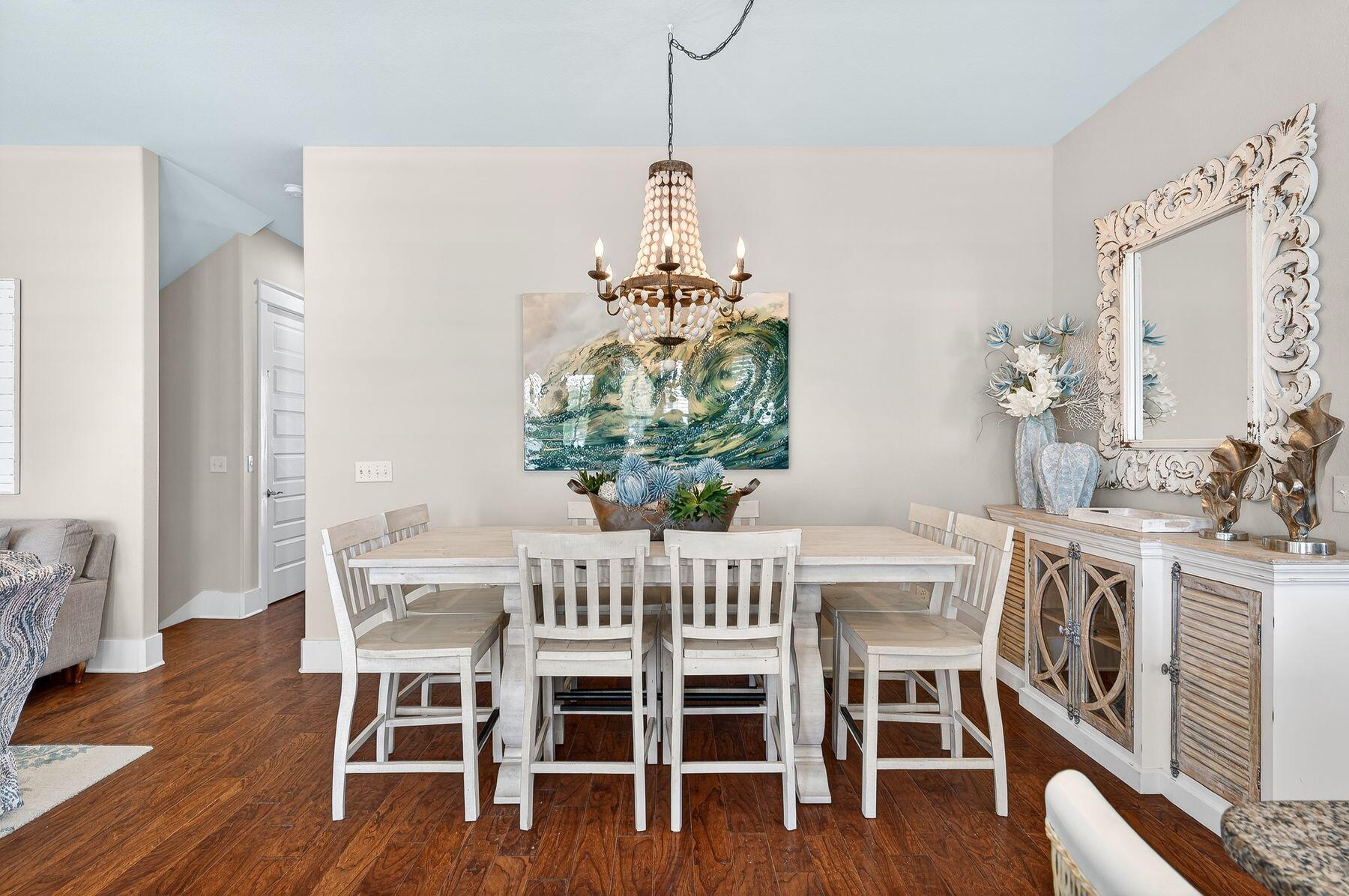 4480 Ocean View Drive Destin, FL 32541 - Photo 9 of 34 a dining room with furniture a chandelier and wooden floor