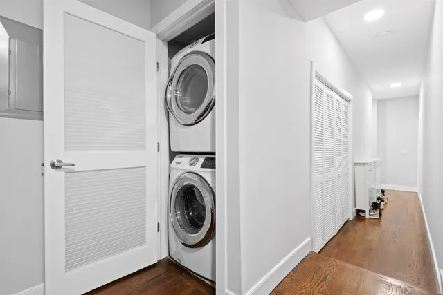 a view of a hallway with washer and dryer