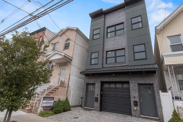 a front view of a house with a garage