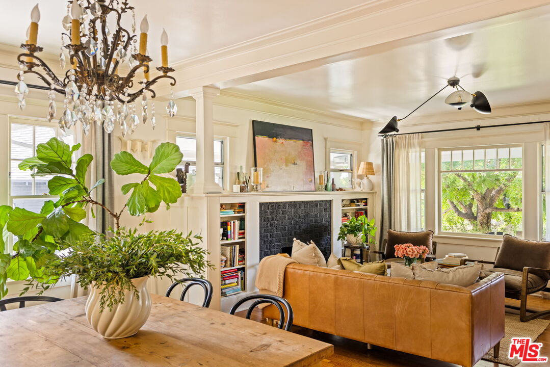 5152 Vincent Avenue Los Angeles, CA 90041 - Photo 11 of 36 a living room with furniture a chandelier and a fireplace