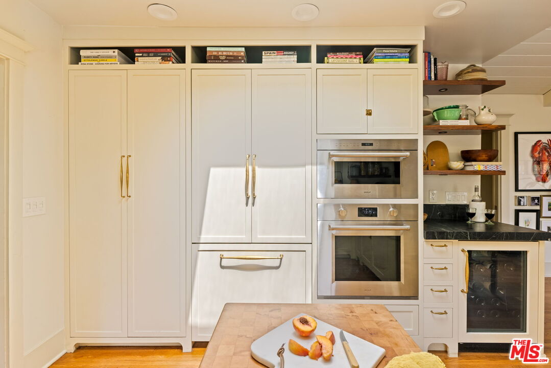 5152 Vincent Avenue Los Angeles, CA 90041 - Photo 16 of 36 a kitchen with stainless steel appliances a refrigerator and a stove
