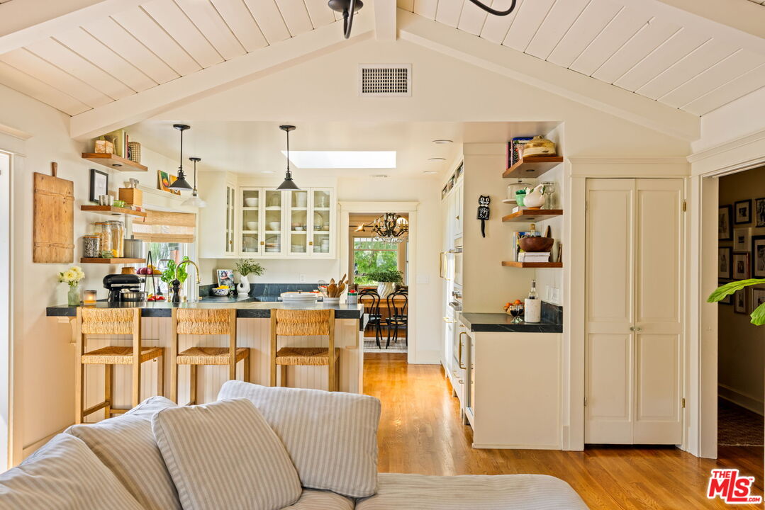 5152 Vincent Avenue Los Angeles, CA 90041 - Photo 18 of 36 a living room with furniture windows and a chandelier