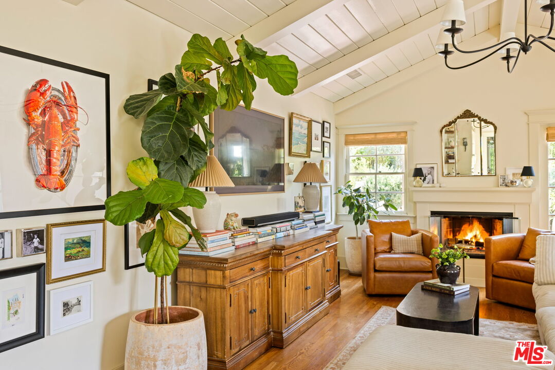 5152 Vincent Avenue Los Angeles, CA 90041 - Photo 20 of 36 a living room with furniture a fireplace and a potted plant