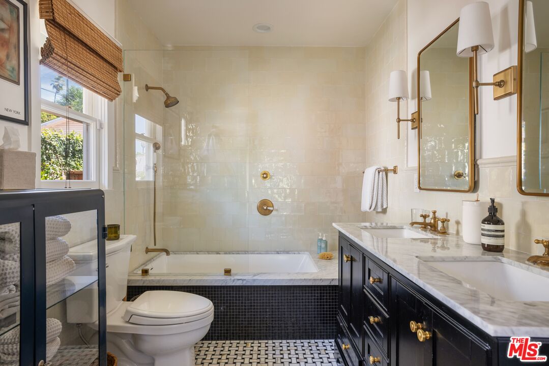 5152 Vincent Avenue Los Angeles, CA 90041 - Photo 30 of 36 a bathroom with a granite countertop sink toilet and shower