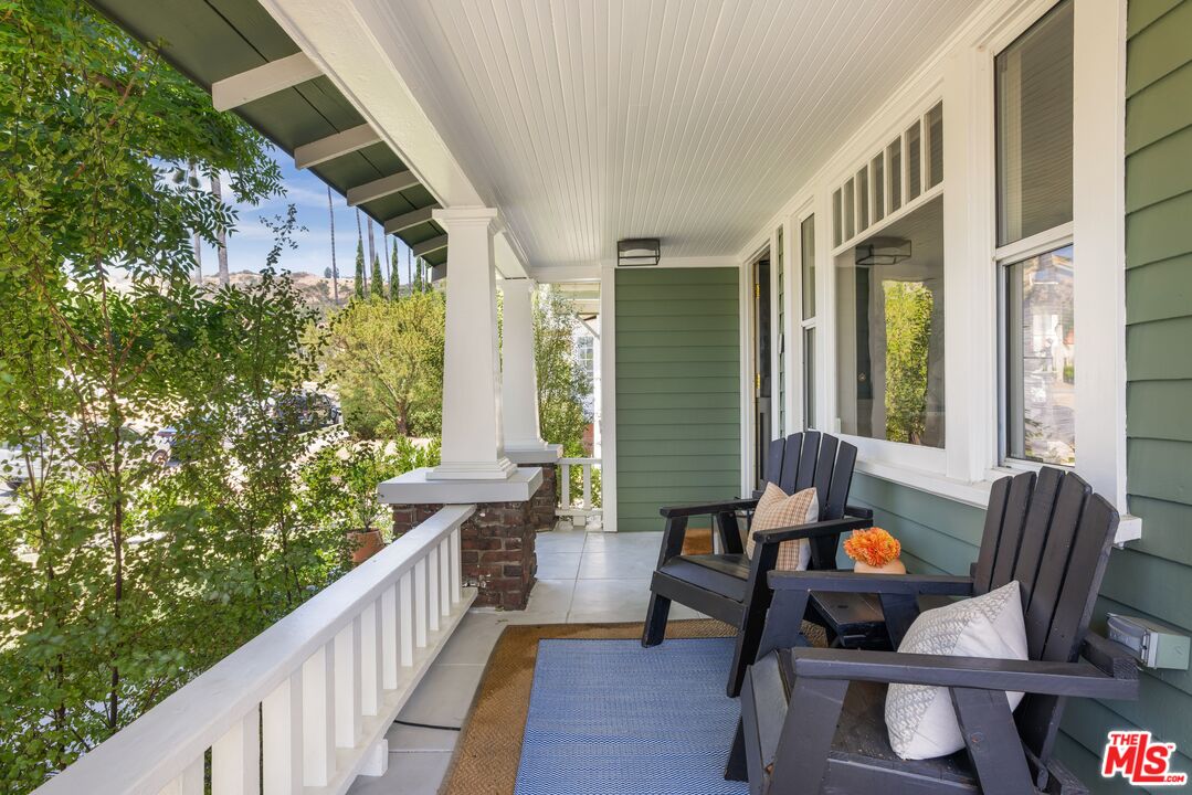 5152 Vincent Avenue Los Angeles, CA 90041 - Photo 3 of 36 a balcony with chairs and a potted plant
