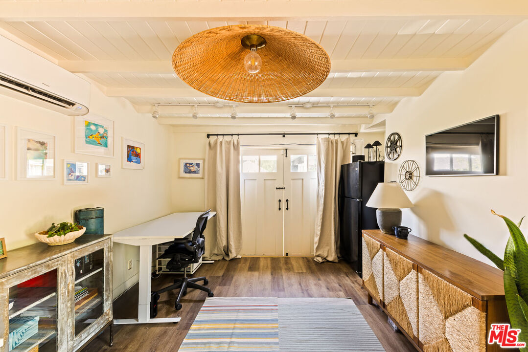 5152 Vincent Avenue Los Angeles, CA 90041 - Photo 35 of 36 a bedroom with furniture and a wooden floor
