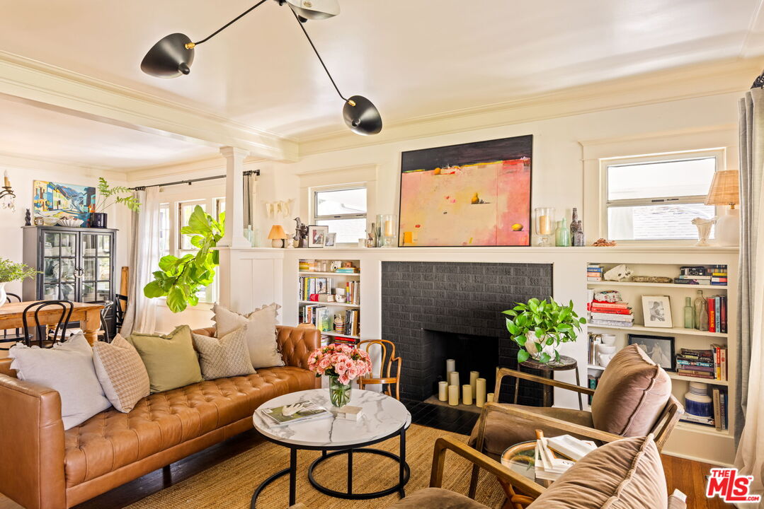 5152 Vincent Avenue Los Angeles, CA 90041 - Photo 5 of 36 a living room with furniture potted plant and a fireplace