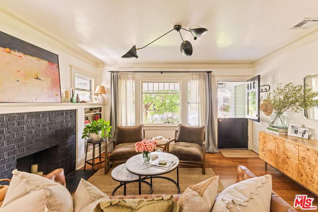 5152 Vincent Avenue Los Angeles, CA 90041 - Photo 6 of 36 a living room with furniture and a fireplace
