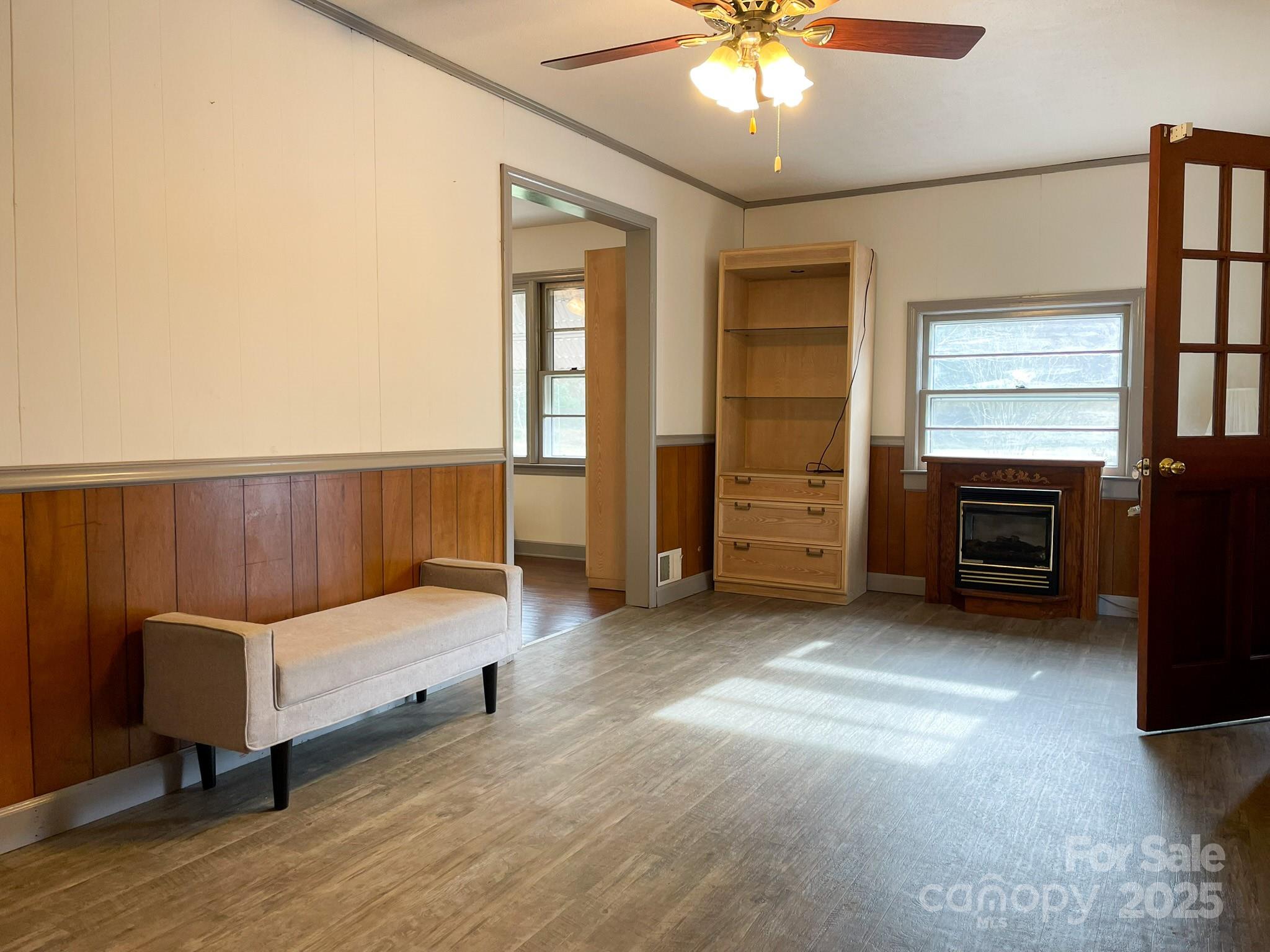 3799 Highway 18 Morganton, NC 28655 - Photo 11 of 33 a bedroom with a bed and a chandelier