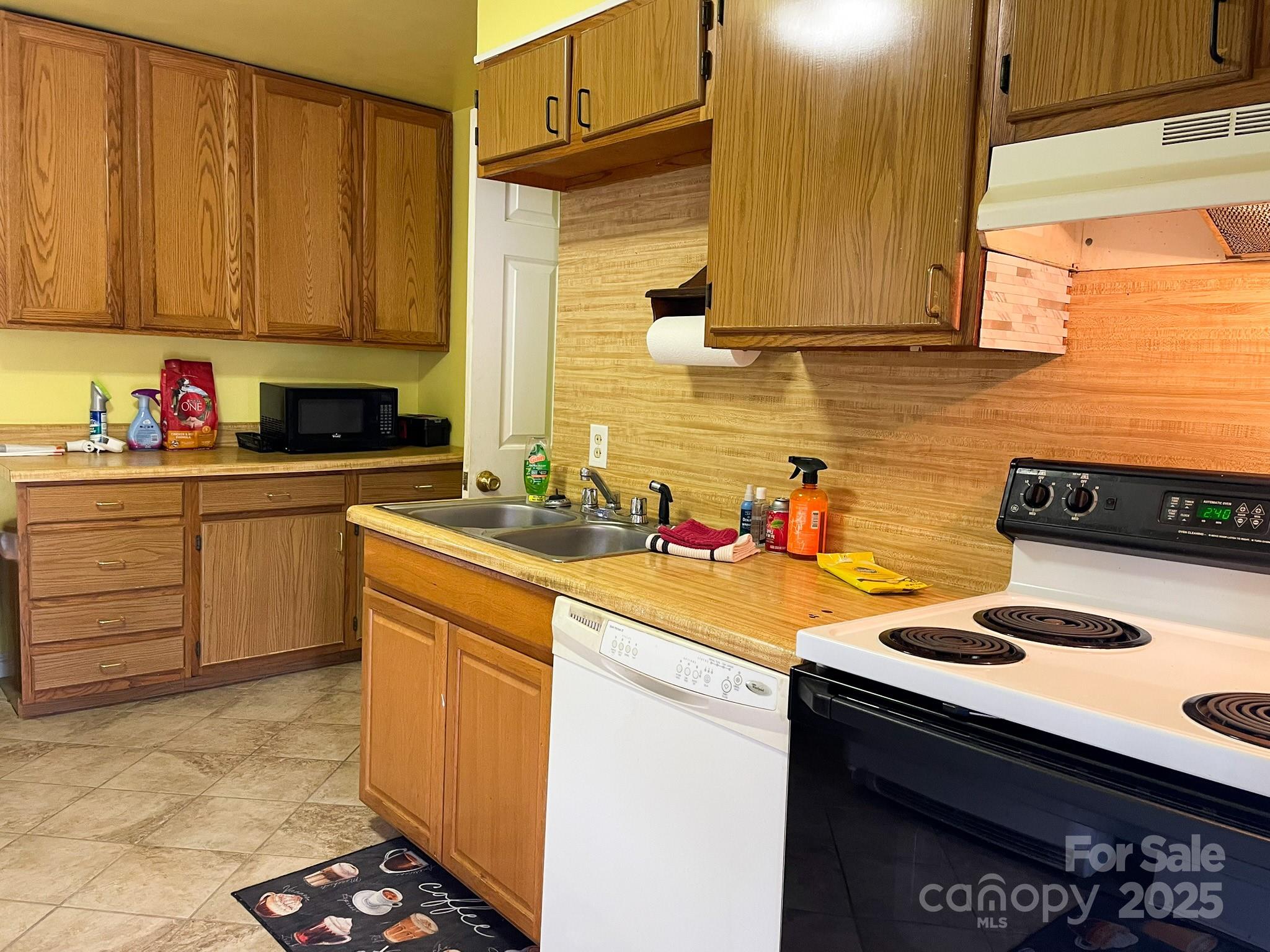 3799 Highway 18 Morganton, NC 28655 - Photo 16 of 33 a kitchen with a sink cabinets and appliances