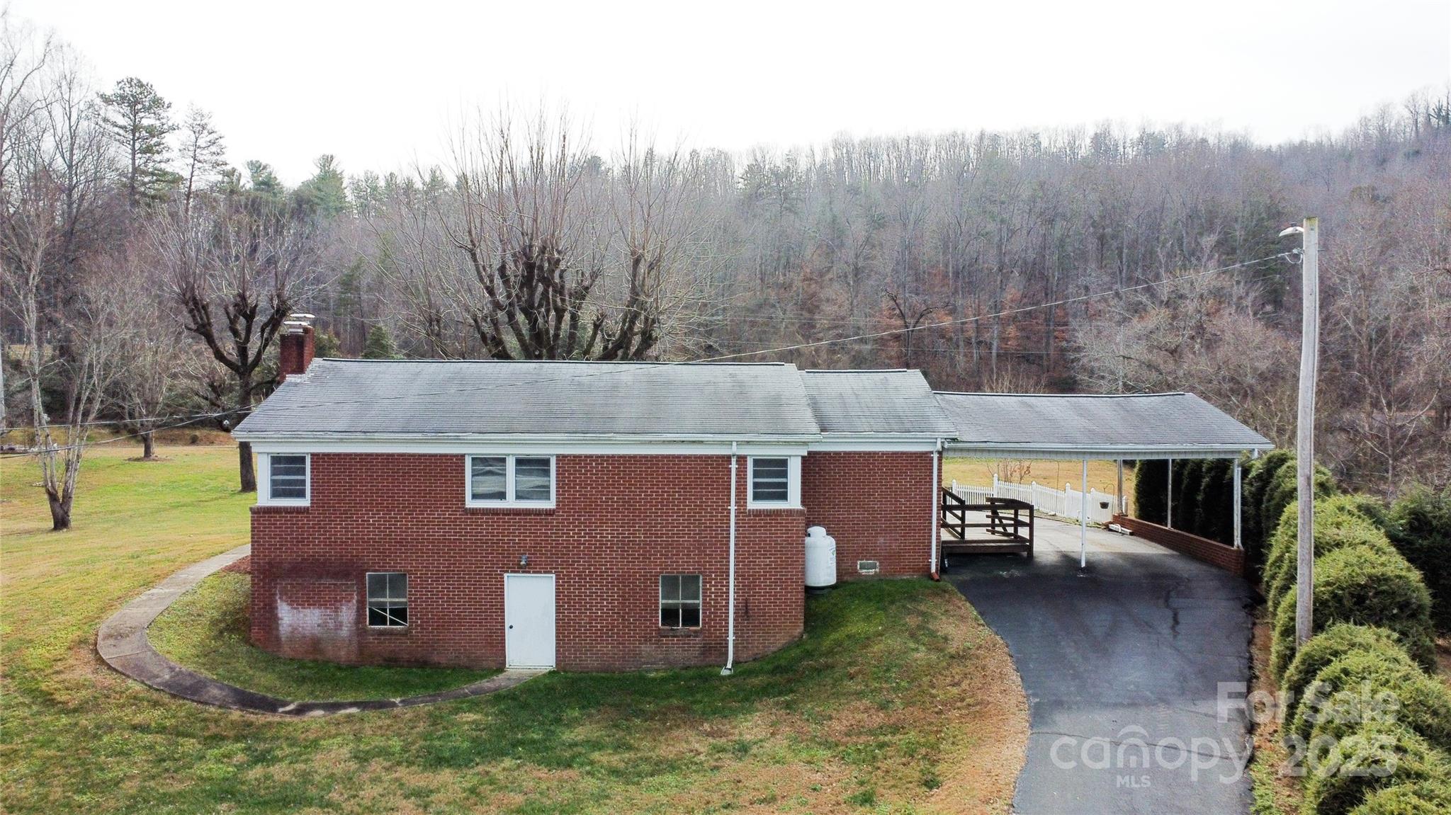 3799 Highway 18 Morganton, NC 28655 - Photo 4 of 33 an aerial view of a house with yard and trees in the background