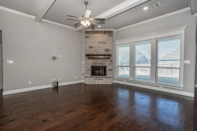 a kitchen with granite countertop a sink a counter top space cabinets and stainless steel appliances