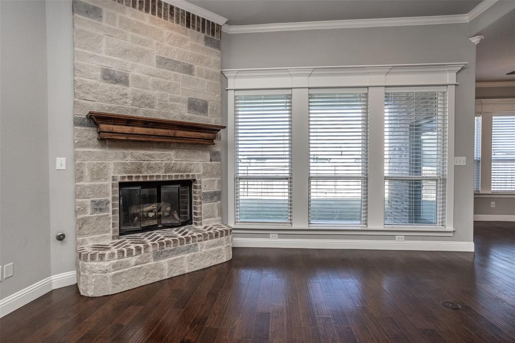 702 La Paloma Road Sanger, TX 76266 - Photo 19 of 40 a living room with furniture and a fireplace