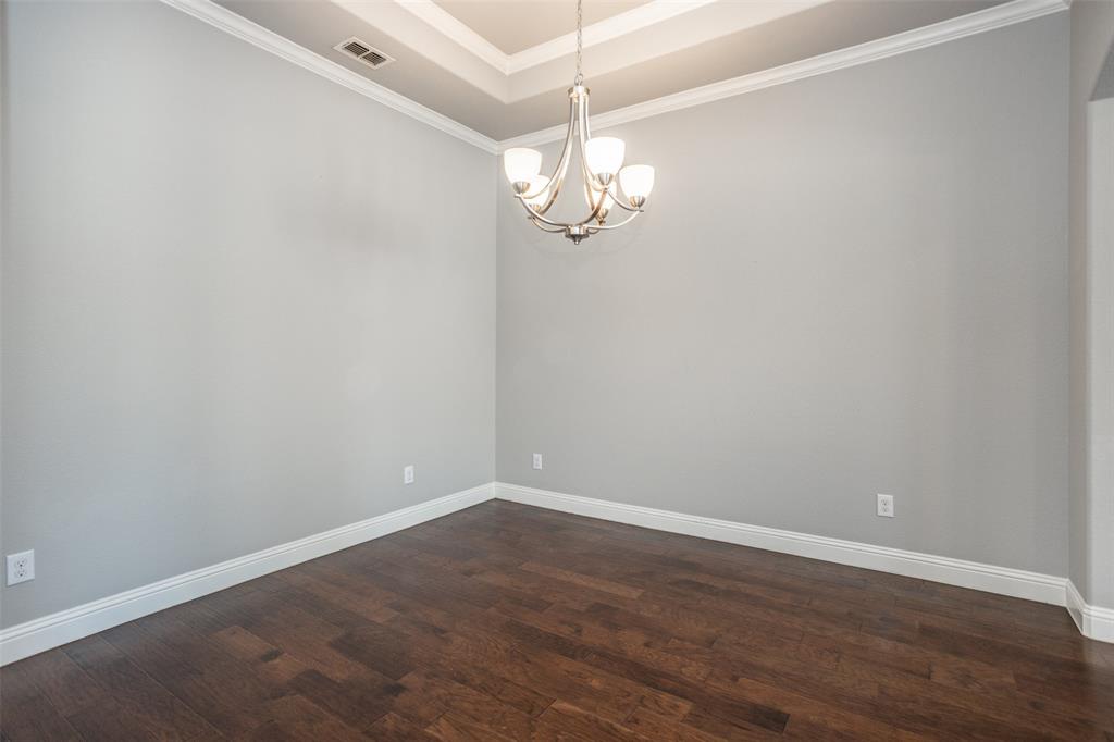 702 La Paloma Road Sanger, TX 76266 - Photo 20 of 40 a view of a room with wooden floor and ceiling fan