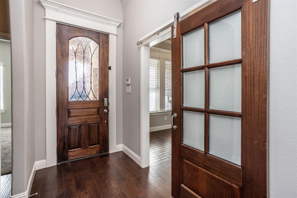 702 La Paloma Road Sanger, TX 76266 - Photo 4 of 40 a view of front door with wooden floor
