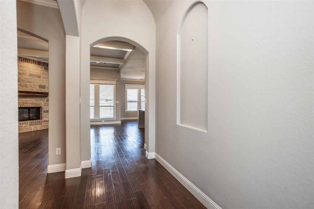 702 La Paloma Road Sanger, TX 76266 - Photo 5 of 40 wooden floor in an empty room with a window