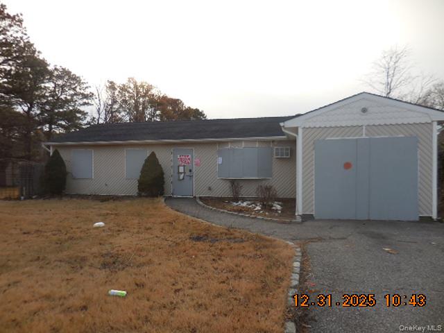 2 Hollow Street Bellport, NY 11713 - Photo 13 of 29 a view of a house with a garage