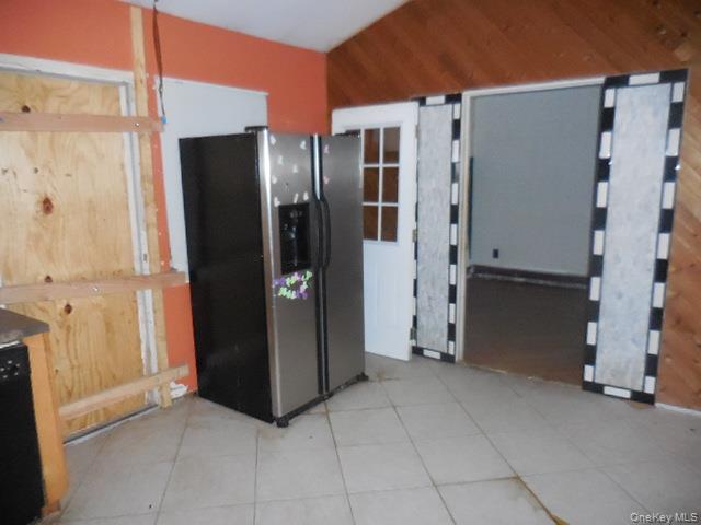 2 Hollow Street Bellport, NY 11713 - Photo 17 of 29 a view of a refrigerator in an empty room