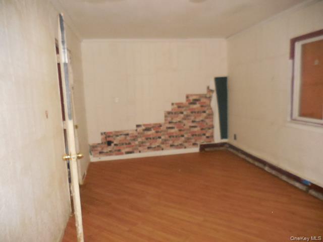 2 Hollow Street Bellport, NY 11713 - Photo 21 of 29 a view of water heater room with wooden floor