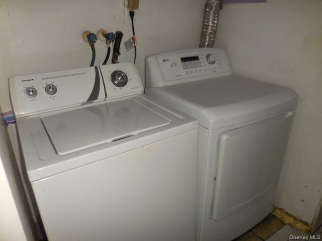 2 Hollow Street Bellport, NY 11713 - Photo 23 of 29 a utility room with dryer and washer