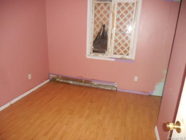 2 Hollow Street Bellport, NY 11713 - Photo 24 of 29 an empty room with a window