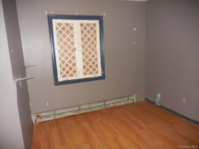 2 Hollow Street Bellport, NY 11713 - Photo 27 of 29 a view of a room with wooden floor and a window