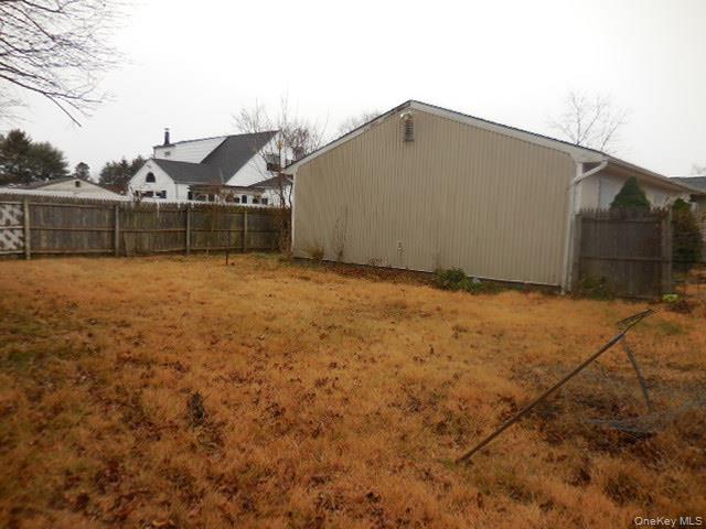 2 Hollow Street Bellport, NY 11713 - Photo 5 of 29 a backyard of a house