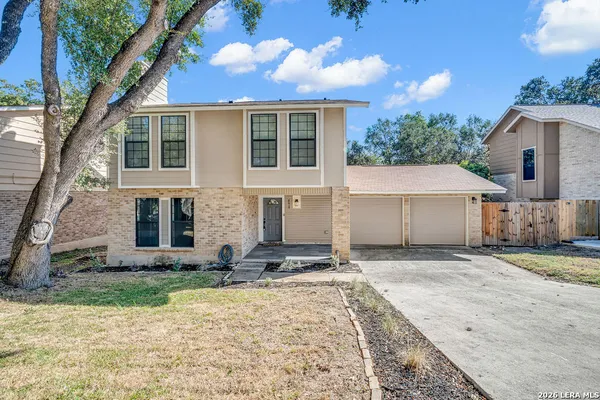 a house view with a backyard space