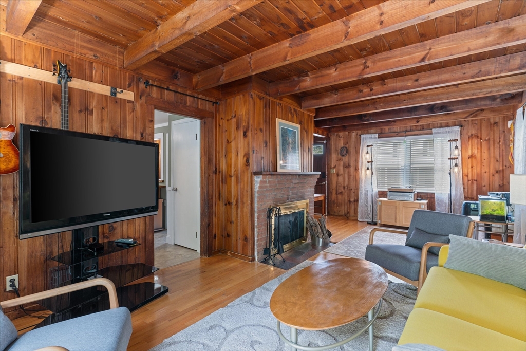 16 Florida Road Maynard, MA 01754 - Photo 12 of 33 a living room with furniture and a flat screen tv