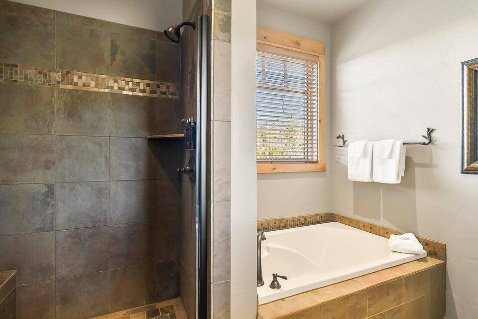 16845 South W Brasada Ranch Road, Unit 23 Powell Butte, OR 97753 - Photo 29 of 47 a bathroom with a tub and a shower