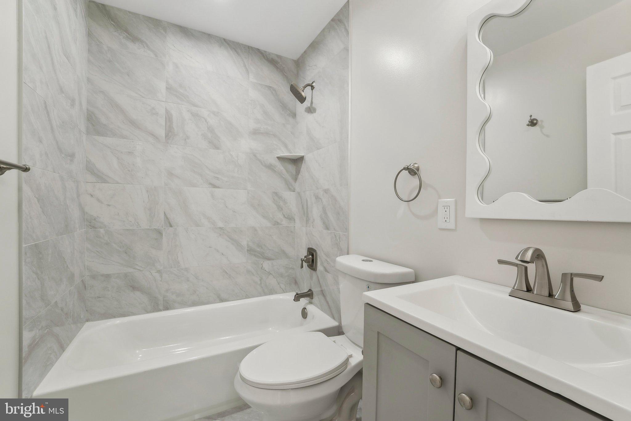 2920 Cornwall Road Dundalk, MD 21222 - Photo 11 of 38 a bathroom with a sink a toilet and a bathtub