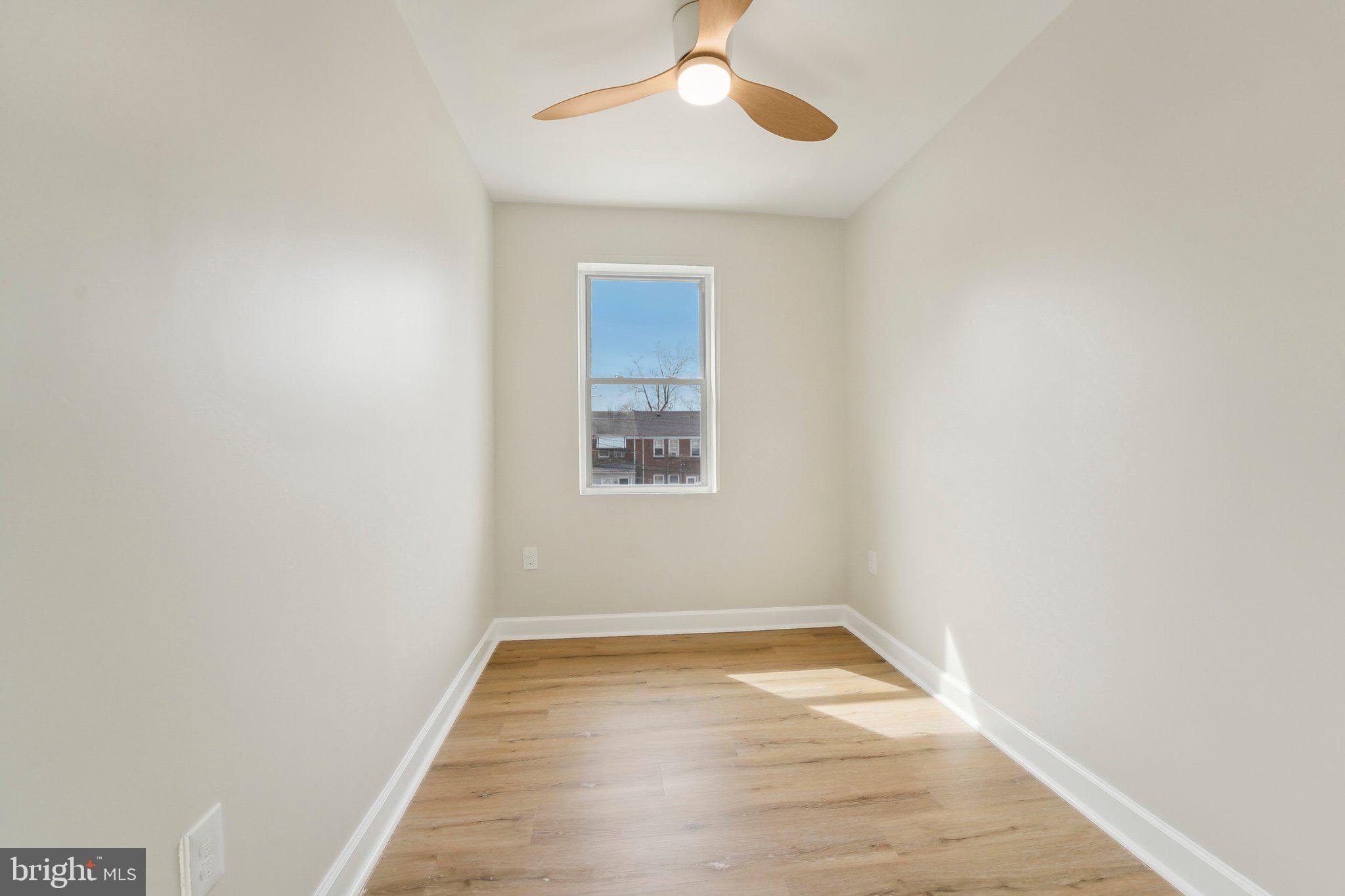 2920 Cornwall Road Dundalk, MD 21222 - Photo 14 of 38 wooden floor in an empty room with a window