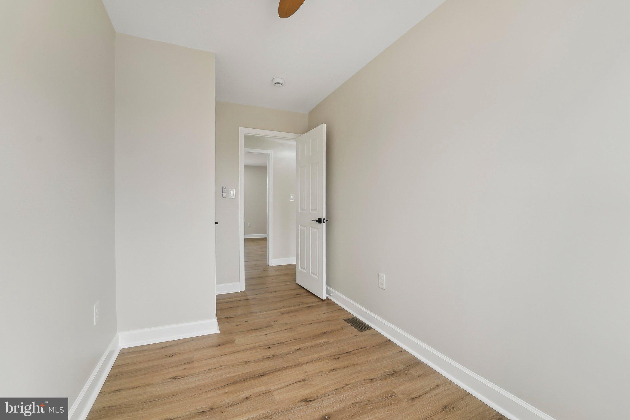 2920 Cornwall Road Dundalk, MD 21222 - Photo 15 of 38 a view of an empty room with wooden floor