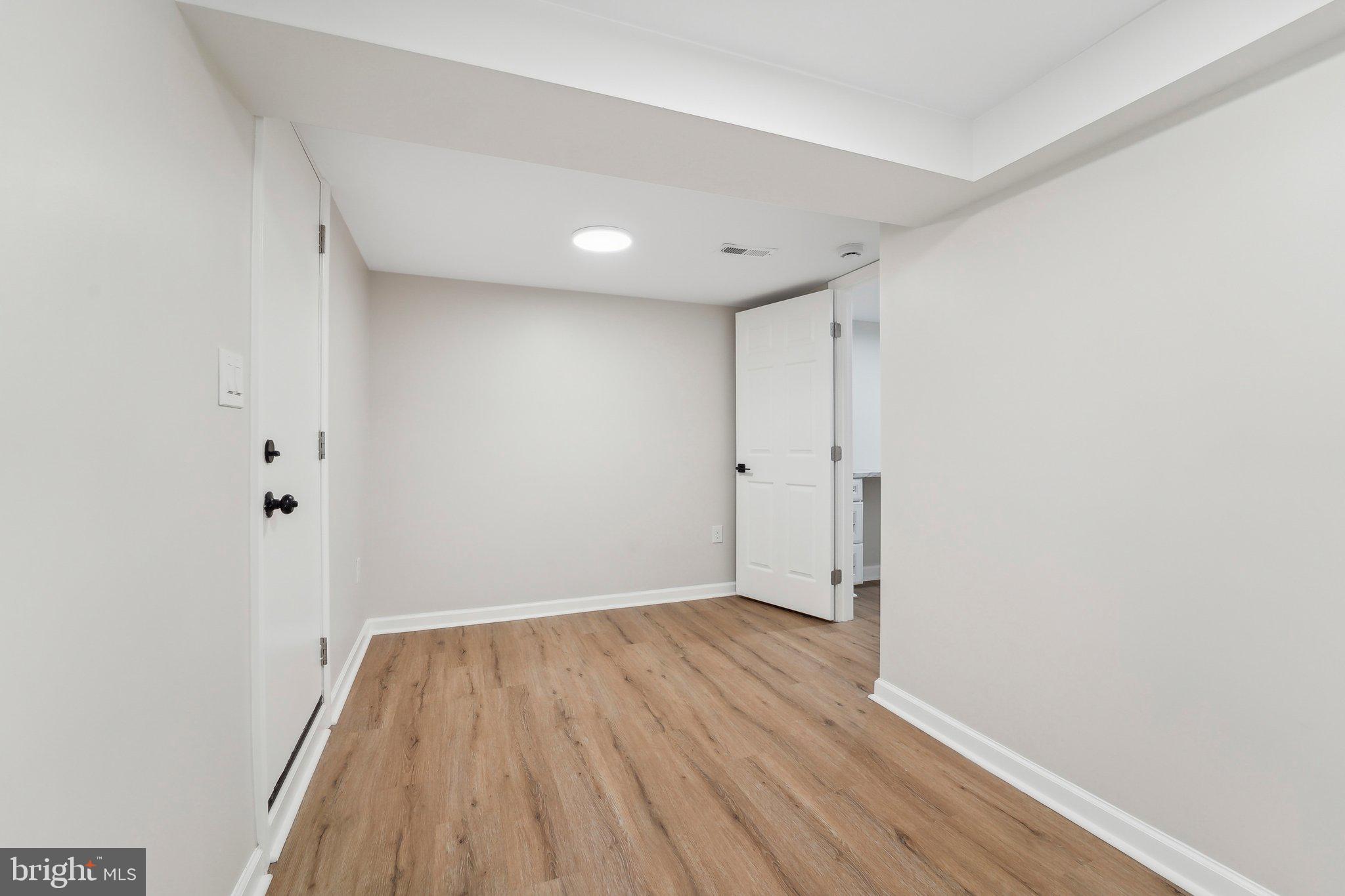 2920 Cornwall Road Dundalk, MD 21222 - Photo 18 of 38 a view of a room with wooden floor and white walls