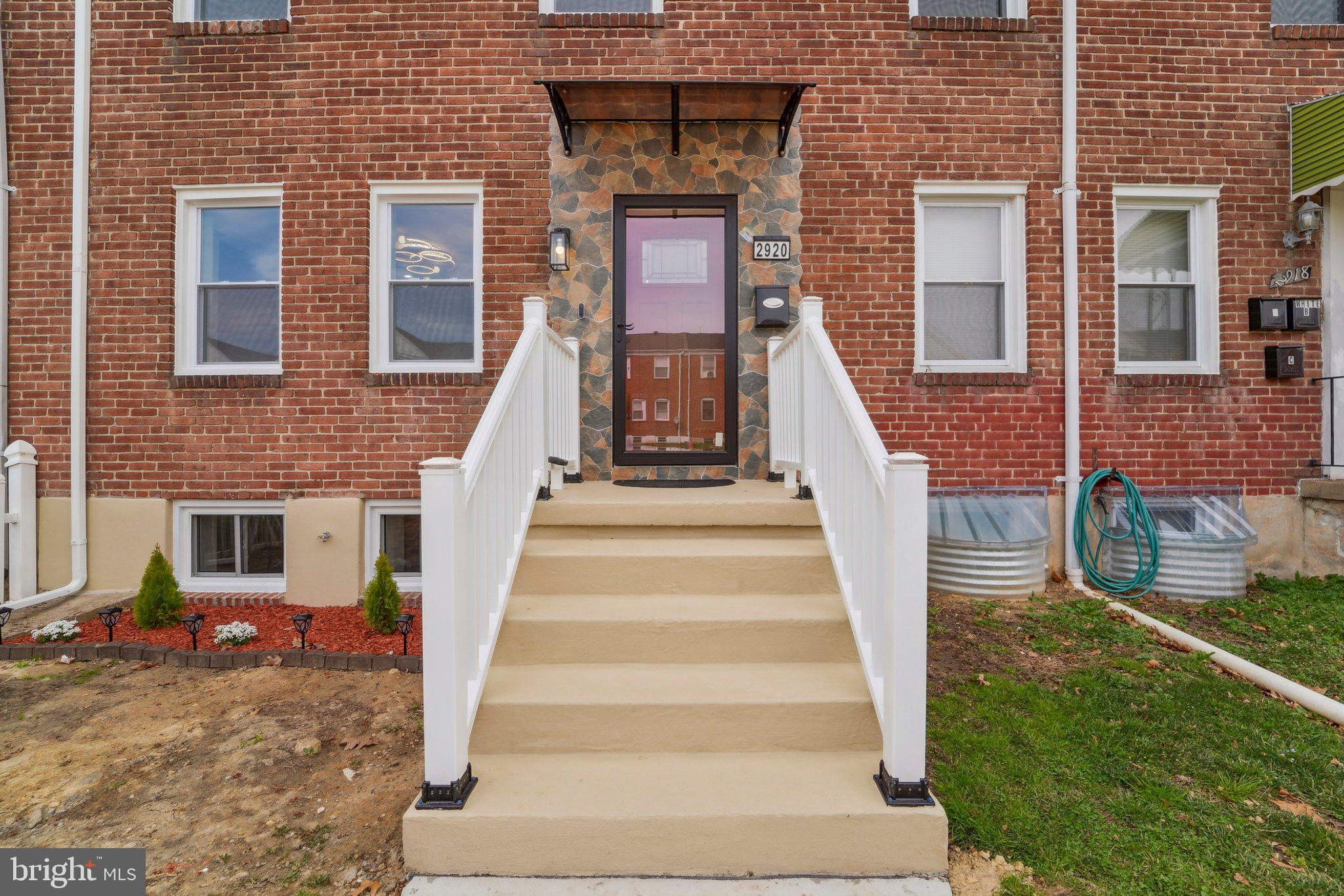 2920 Cornwall Road Dundalk, MD 21222 - Photo 24 of 38 a front view of a house with wooden stairs