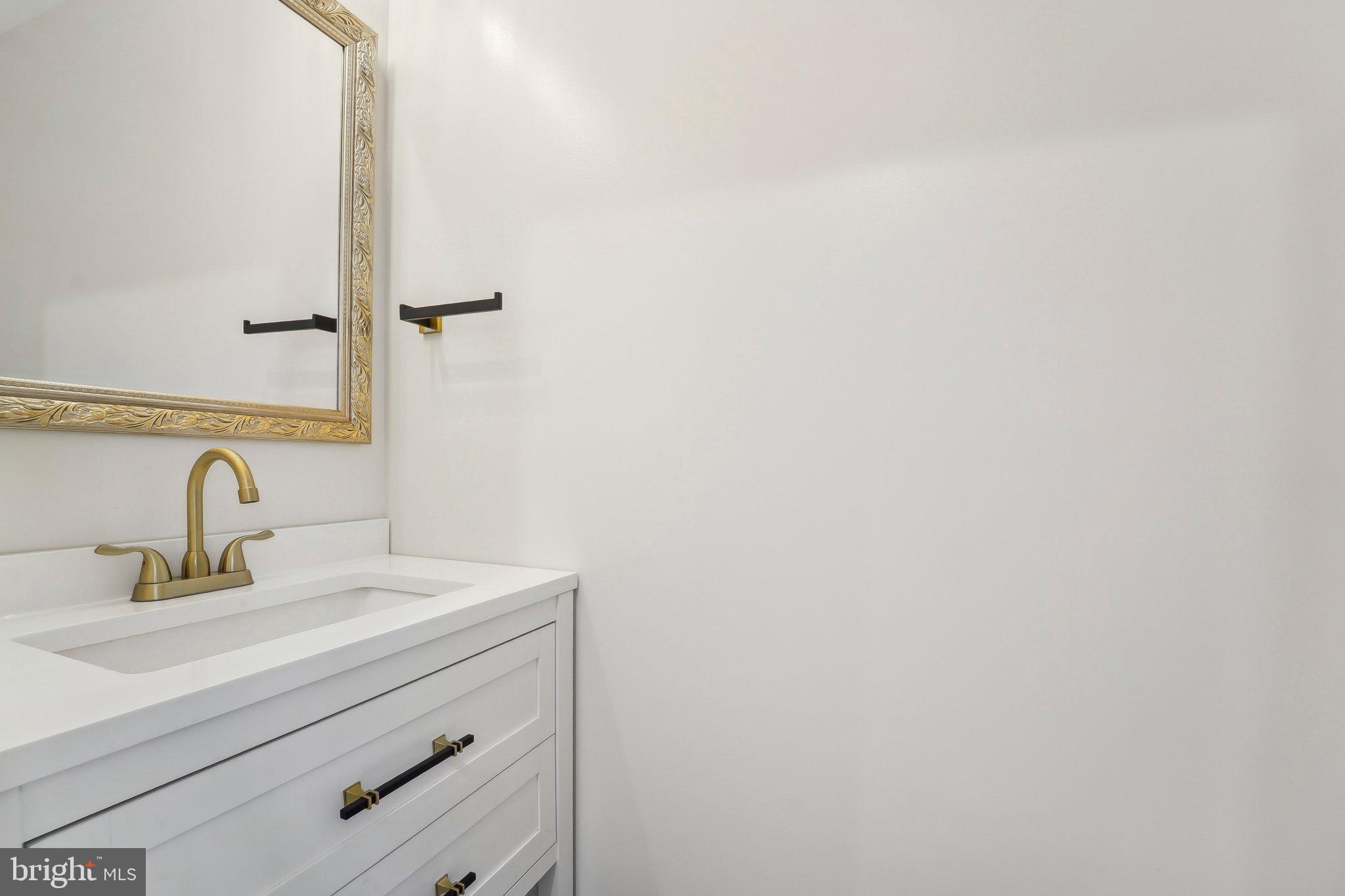 2920 Cornwall Road Dundalk, MD 21222 - Photo 26 of 38 a bathroom with a sink and a mirror