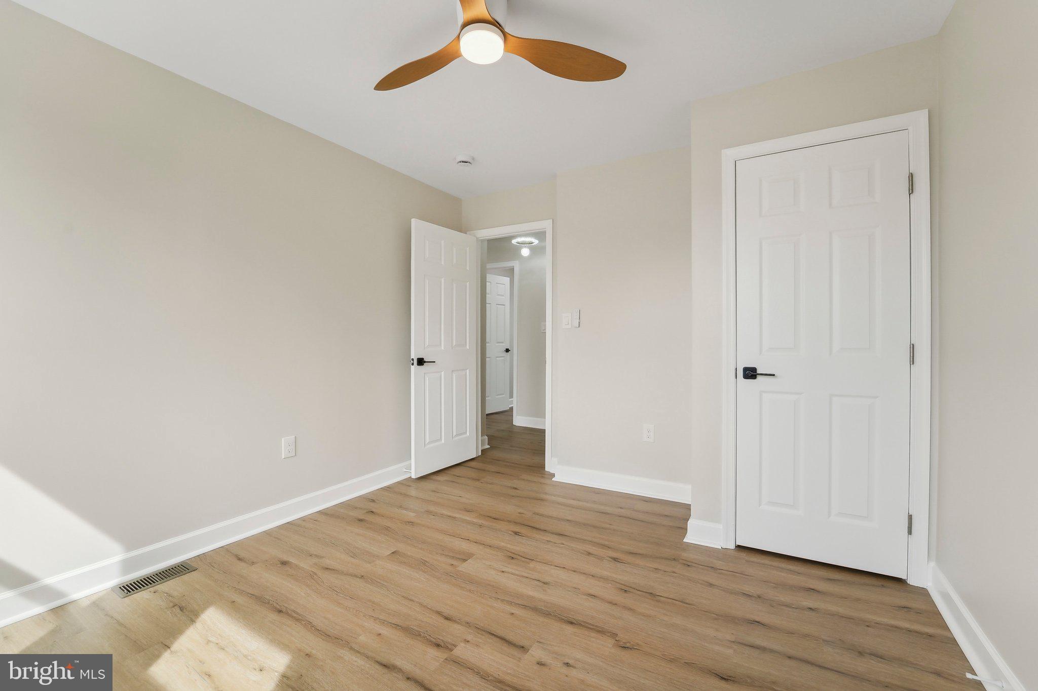 2920 Cornwall Road Dundalk, MD 21222 - Photo 31 of 38 a view of an empty room with wooden floor