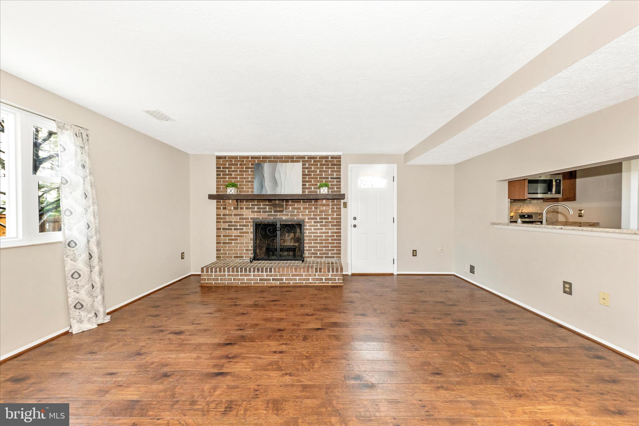 6616 Pebble Court Frederick, MD 21703 - Photo 12 of 33 a view of empty room with a fireplace