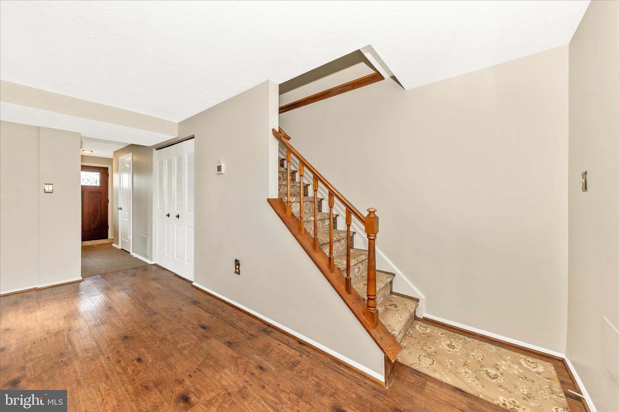 6616 Pebble Court Frederick, MD 21703 - Photo 14 of 33 a view of an entryway with wooden floor