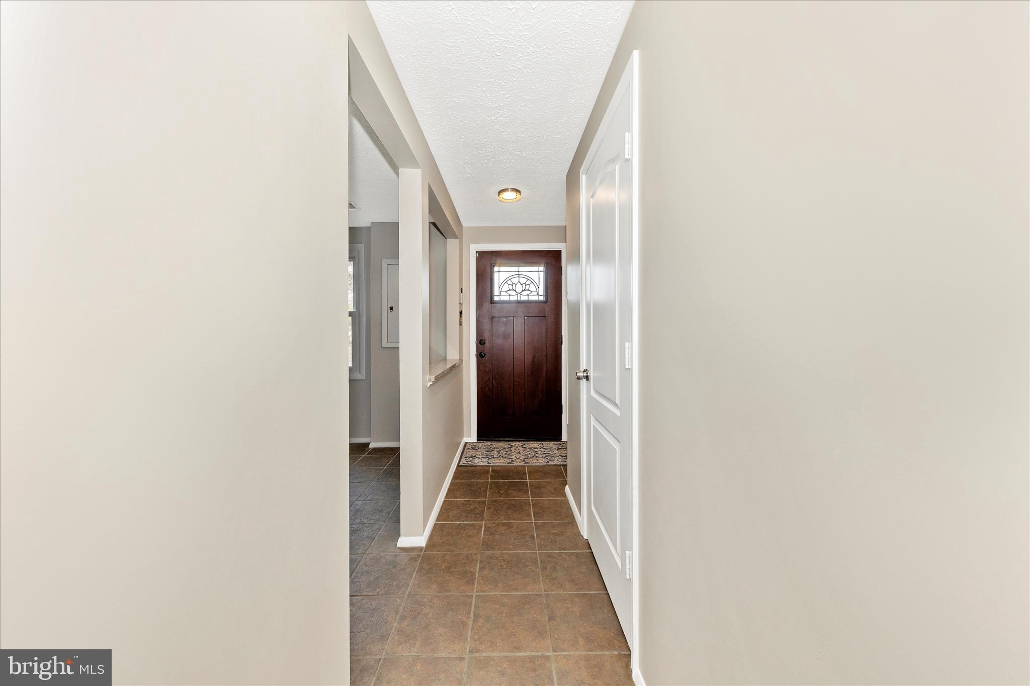 6616 Pebble Court Frederick, MD 21703 - Photo 2 of 33 a view of a hallway with wooden floor